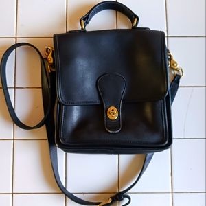Sleek Coach bag with gold hardware
